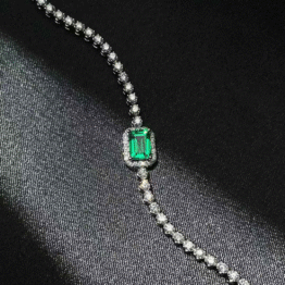 The "Verdant Empress" Green Diamond Platinum Tennis Bracelet