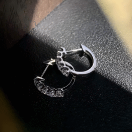 The "Stellar Curve" Platinum Five-Stone Hoops