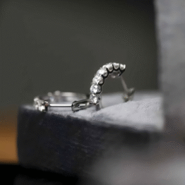 The "Infinity Arc" Platinum Seven-Stone Hoops